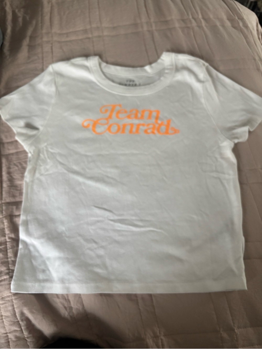 American Eagle Outfitters White Tee with Neon Orange 'Team Conrad' Graphic